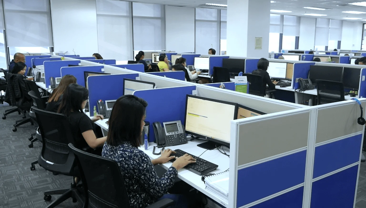 Illustration of call center outsourcing with Garage2Global, showcasing professional agents delivering customer support solutions to improve efficiency and reduce costs.